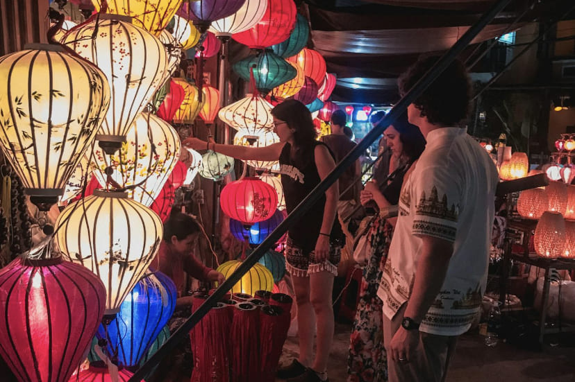 Lantern-lit street in Hoi An Ancient Town at night with bars and restaurants