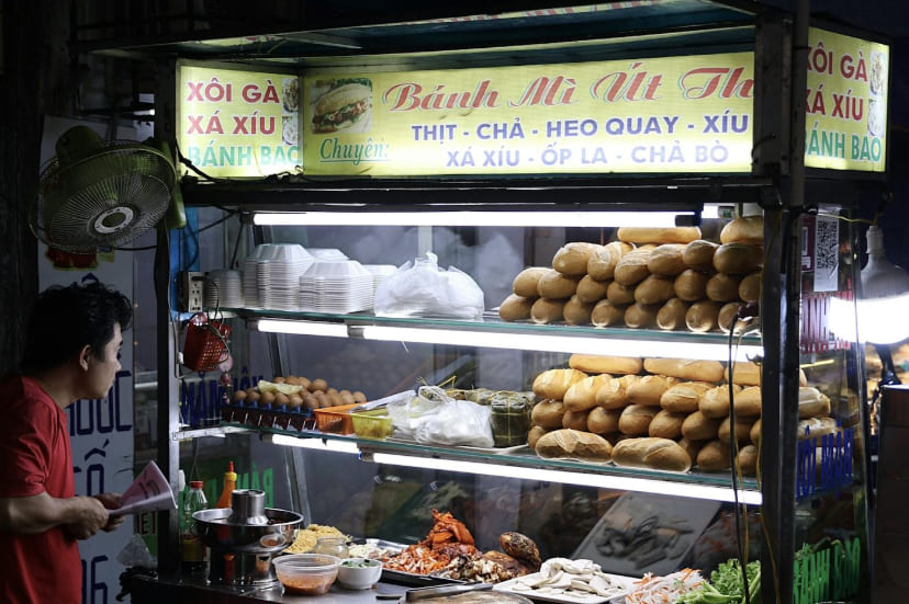 Late night street food vendor in Hoi An with colorful lanterns
